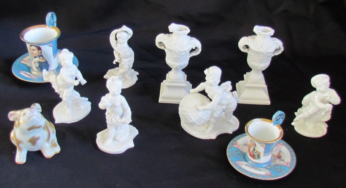 Seven Figural Items: Lot of 7 ceramic figural items, rabbit figure and two Austrian cups and saucers, as-is