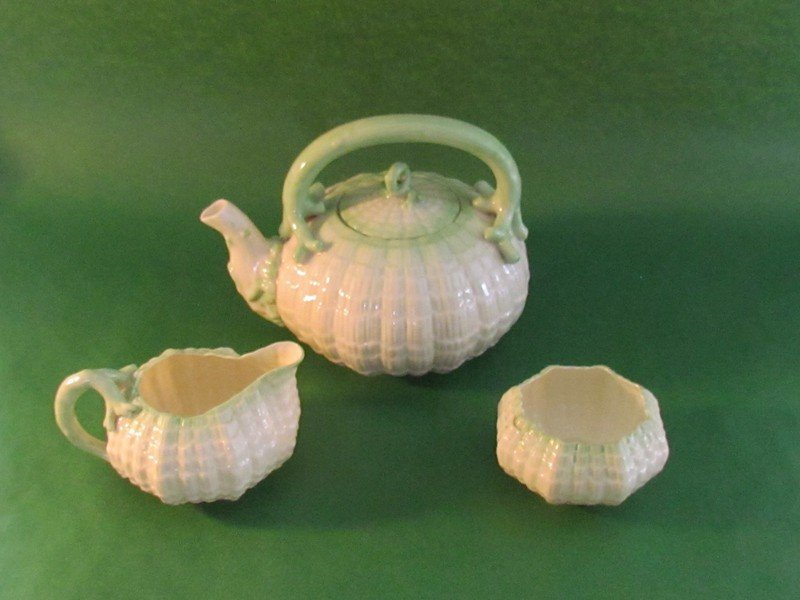 Lot of three pieces of green Tridacna pattern ware: Lot of three pieces of green Tridacna pattern ware items including a tea kettle, creamer and sugar. All are second mark, black, ht. 7. wd. 7 1/2