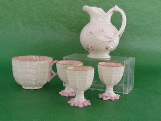Small lot of Irish Belleek: Small lot of Irish Belleek, a shamrock creamer with small chips, three egg cups and a tea cup without saucer. All first mark black, ht 4, wd. 3 1/2