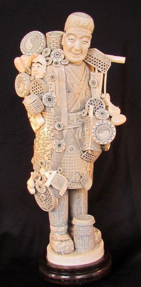 Massive Japanese Sectional Ivory Meiji Period: Massive Japanese Sectional Ivory Meiji Period, basket vendor, height 20 1/4, width 9, depth 7, form fitted base ht. 2 1/2. Provenance: former board member of Bruce Museum.