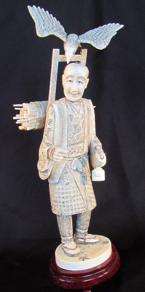 Massive Japanese Sectional Ivory Meiji Period: Massive Japanese Sectional Ivory Meiji Period, man with bird, height 13, width 5 3/4 inches, stand 1 1/2. Provenance: former board member of Bruce Museum.