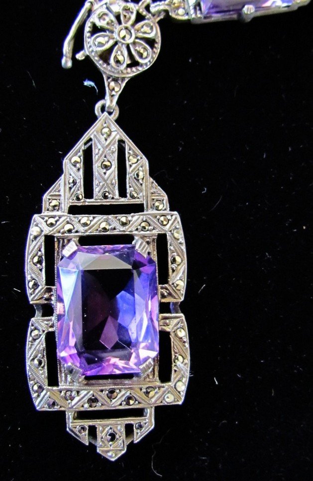 Victorian Amethyst and Marcasite Necklace in Sterli: Beautiful Victorian necklace adorned with faceted prong set amethyst and marcasite in alternating links . The center pendant measures 1 3/4 in. lg. and 2/4 in. wide, with a large 15mm by 12mm center s
