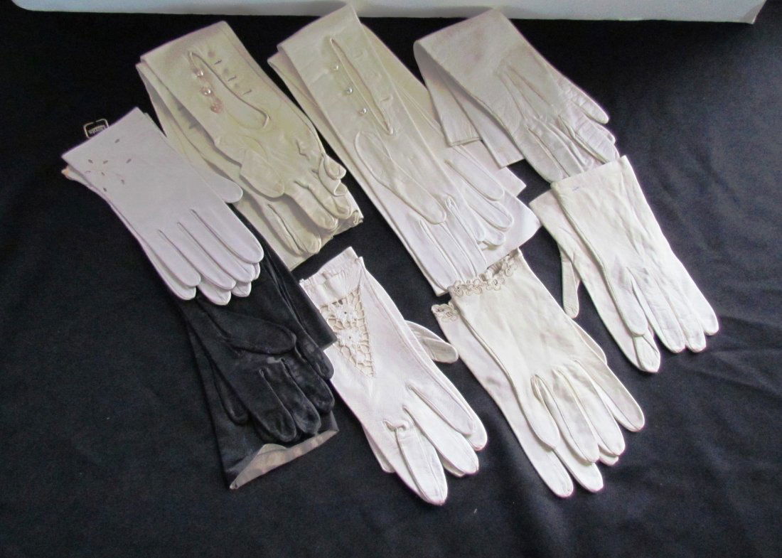 8 Pairs of Ladies Gloves.: Eight pairs of ladies leather gloves and two fur hats, mink labeled “Elizabeth Ford, New York.” Gloves have some staining. Various lengths.