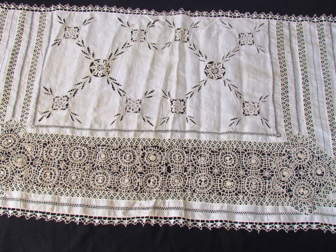 Antique Handmade Lace.: Piece of antique handmade fabric with intricate lace patterns.