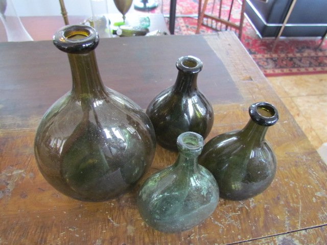 Group Four Early Chestnut Bottles: Group Four Early Chestnut Bottles, largest ht. 7, wd. 5. One with small chip on lip.