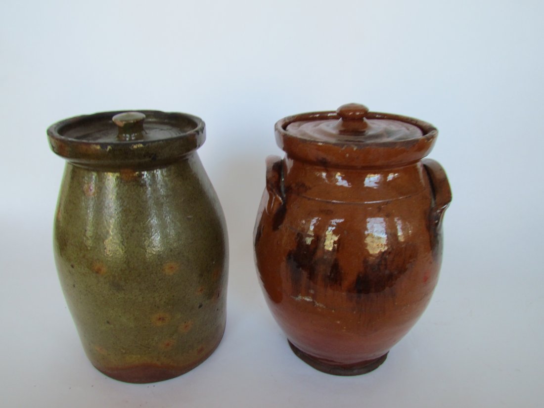 Two Covered Redware Jars: Two Covered Redware Jars, ht. 9, wd. 5 1/2, green lid cracked
