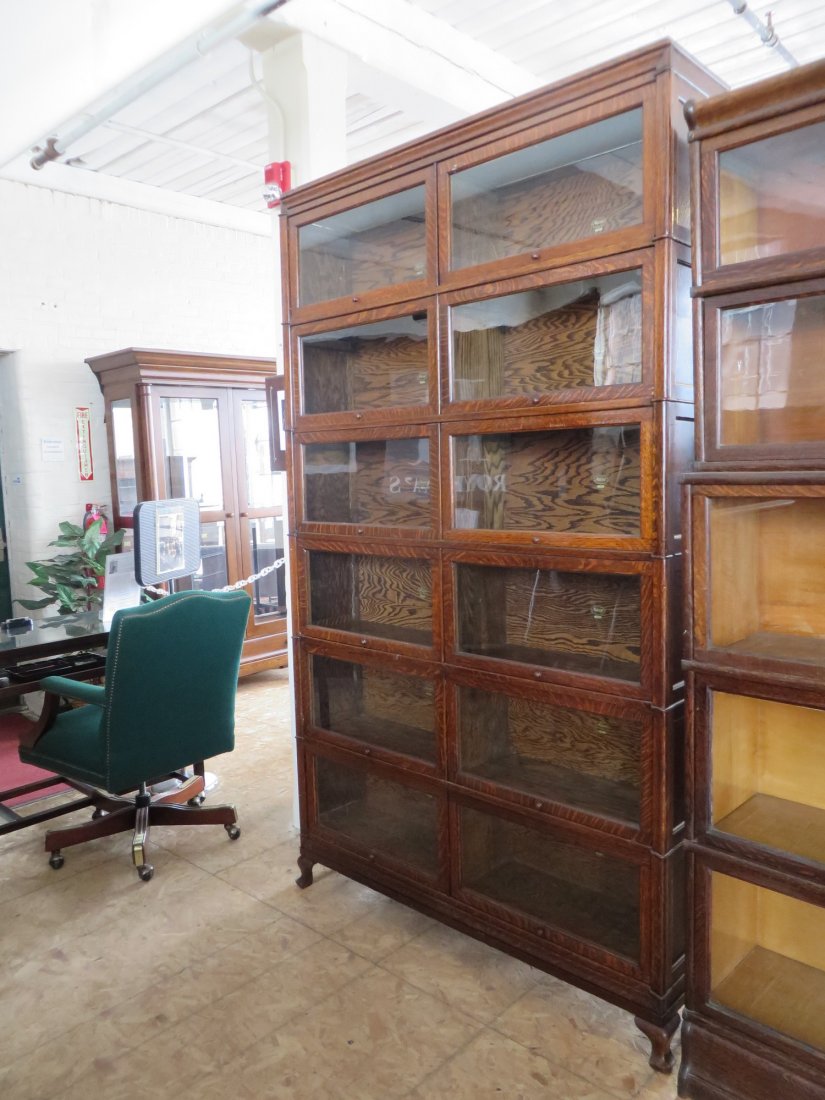 Large Macey Oak Double Stack Twelve Door Barrister: Oak Macey Double Stacker Barrister Oak Bookcase. The 6 section double stacker has 12 glass front doors that swing up and slide into the top of each section, stands on carved feet, has nice quartersawn