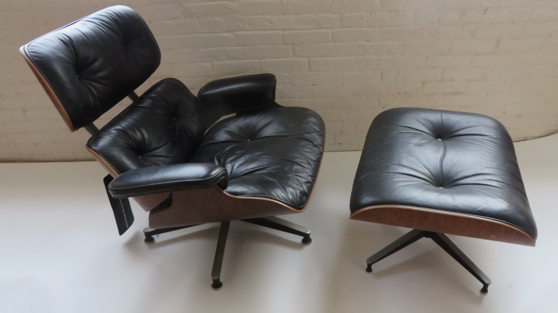 Charles Eames Herman Miller Chair & Ottoman: Charles Eames Herman Miller Chair & Ottoman, leather, original tag (Other modern item of interest See lot 138 for Prototype Modern Clock from New York World's fair) Condition: Over all very nice. No b