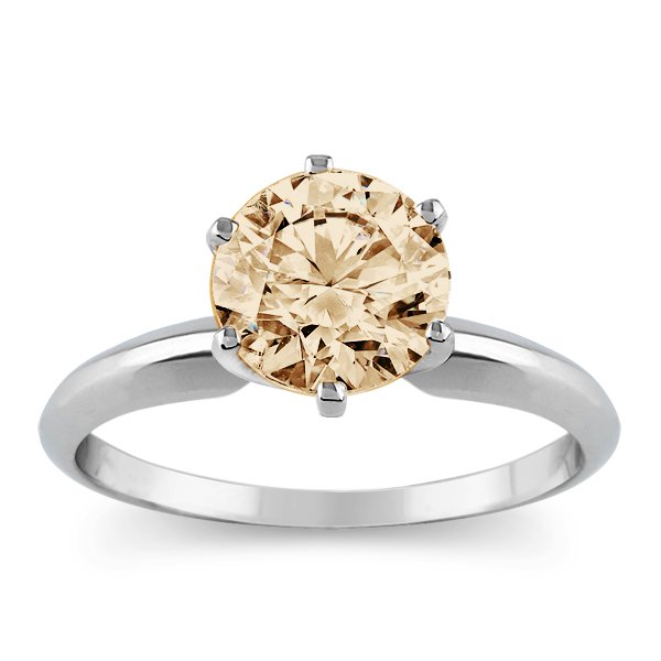 1 Carat Diamond solitaire ring in 14 k gold: 1.10 carat champagne colored round diamond solitaire ring set in 14 k gold