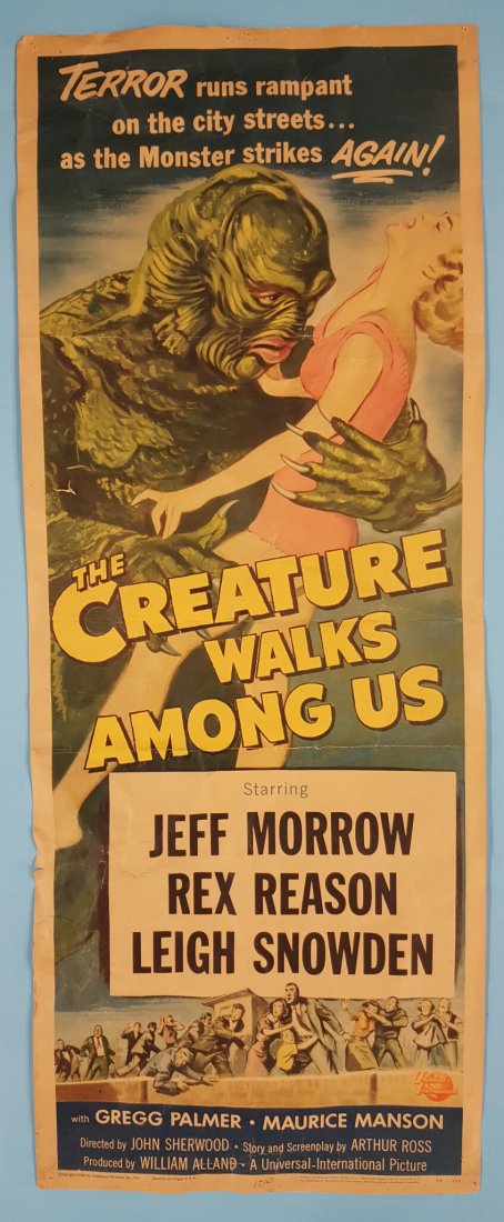 The Creature Walks Among Us 1956 14" x 36" Movie Poster: A Universal International picture starring Jeff Morrow, Rex Reason, & Leigh Snowden. This is an unrestored poster. The poster is complete with 3 horizontal folds, edge wear, 2 small tears on the left 
