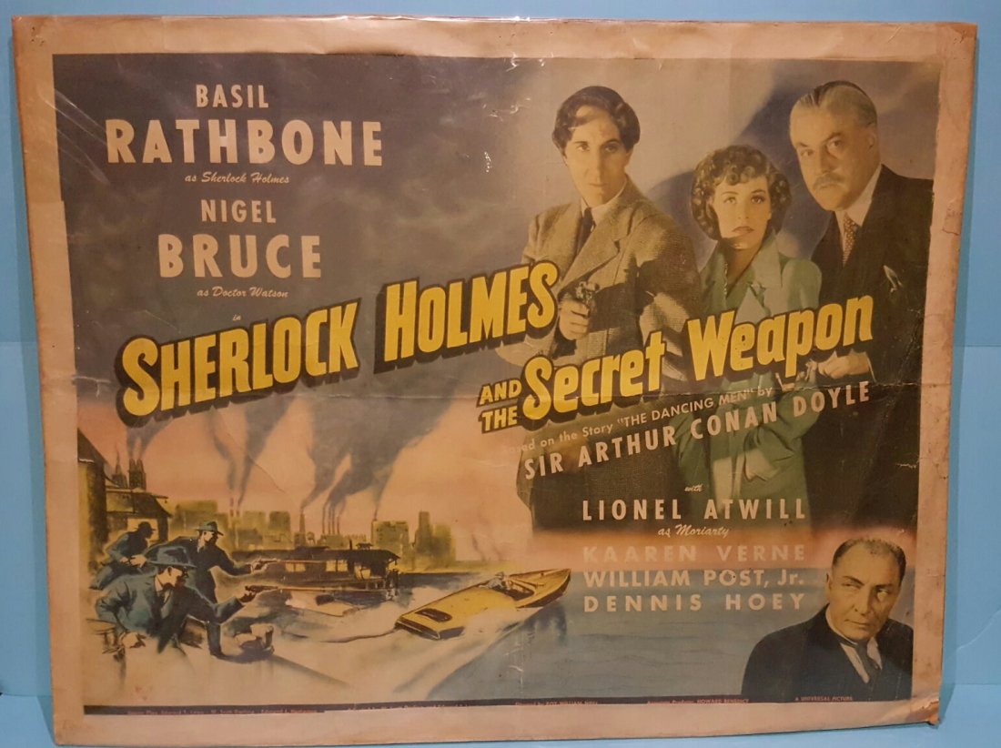 Sherlock Holmes and the Secret Weapon 1942 Movie Poster: A Universal picture starring Basil Rathbone & Nigel Bruce. This is a Scarce unrestored half sheet poster with horizontal & vertical folds, tape around the border, pinholes, paper loss at bottom right 