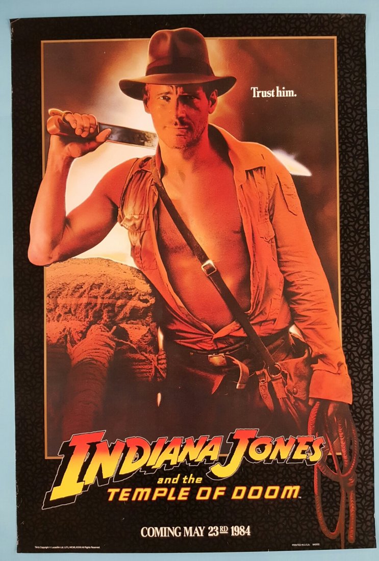 Indiana Jones and the Temple of Doom 1984 Movie Poster: Paramount 1984 starring Harrison Ford - 27' x 40" One sheet with black background rolled unrestored poster with minor edge wear and rippling. A clean poster.