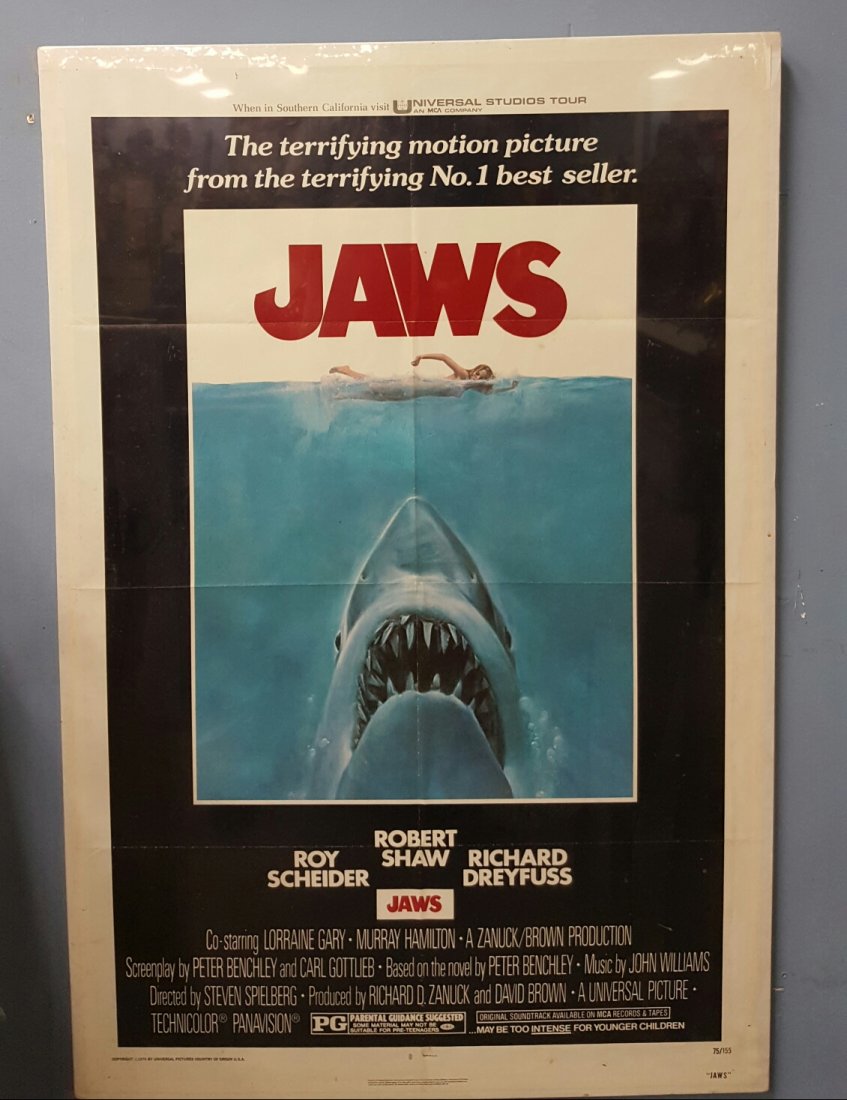 Jaws 1975 One Sheet Movie Poster 27" x 41": (Universal) Starring Roy Scheider, Robert Shaw, Richard Dreyfuss. This is a folded unrestored poster in excellent condition on foam board protected with a clear wrap. The poster can be removed and fol