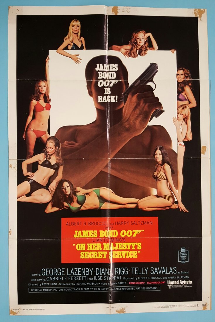 On Her Majesty's Secret Service 27" x 41" Movie Poster: (United Artists) (1970) Starring George Lazenby. This is the only time Lazenby would play the role of James Bond. This is a folded unrestored poster with fold wear, tape stains from the back, edge wea
