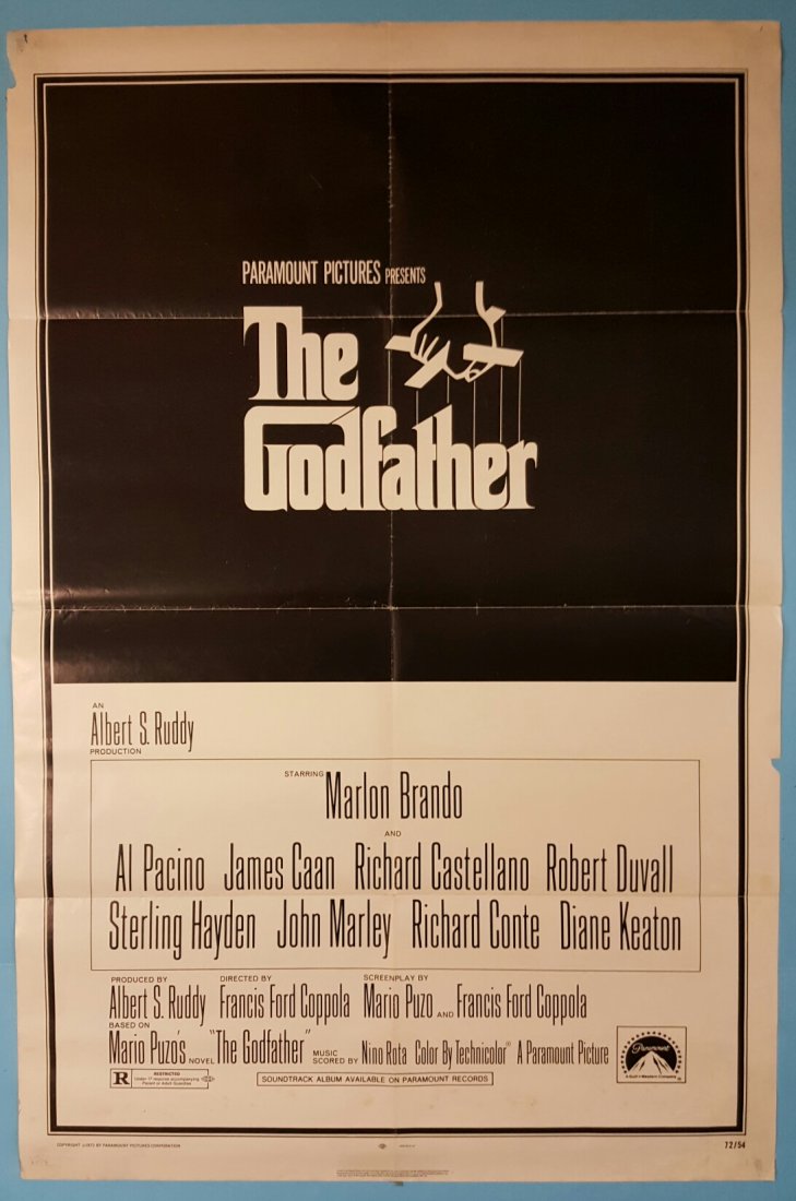 The Godfather 1972 One Sheet Movie Poster 27" x 41": (Paramount) Starring Marlon Brando, Al Pacino, James Caan, Richard Castellano, Robert Duvall, & Diane Keaton. This is a folded unrestored poster with overall presentable appearance with fold wear and