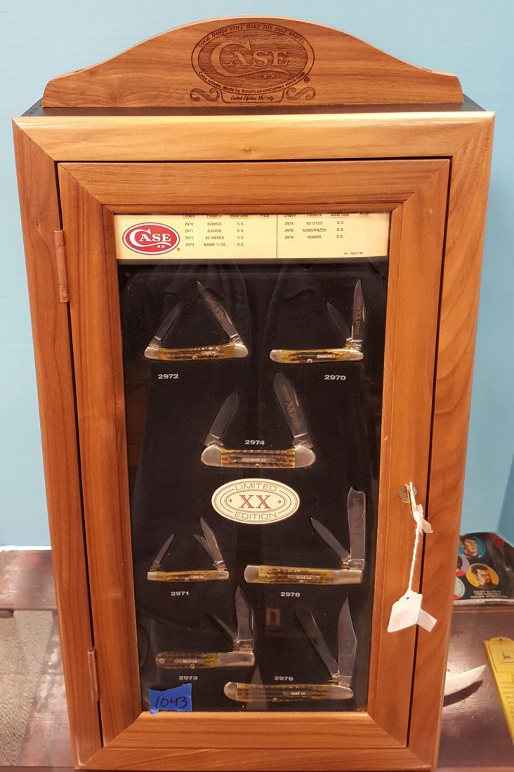 7 Limited Edition XX Case Knives & Wood Display Case: This is 1 of 2500 limited edition sets. The display case has a slant front with plexiglass window to show the knives and wood trim. there is a handsome solid wood topper with the Case logo engraved in