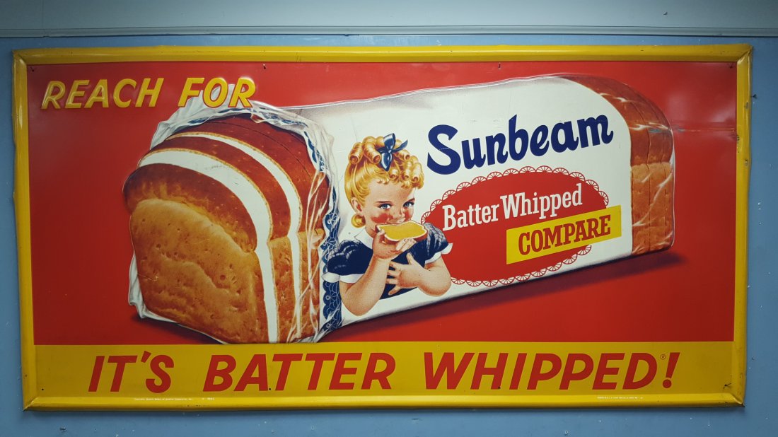 1966 NOS Embossed Sunbeam Bread Batter Whipped Sign: 70" x 35" Very Scarce New old stock sign with embossed loaf of bread with little Miss Sunbeam. There are some scratches in the upper right corner from being in storage. Still a very clean sign and har
