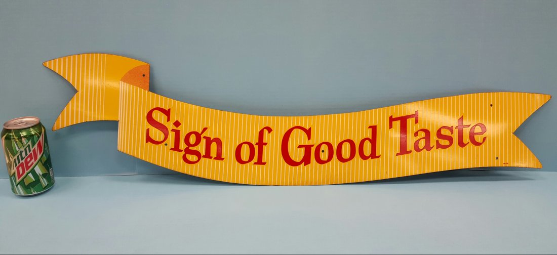 Scarce Coca Cola Sign of Good Taste Metal Ribbon Sign: 34.5" x 6.5"h Circa 1950's New old stock Yellow ribbon sign with white pinstripes and red letters.