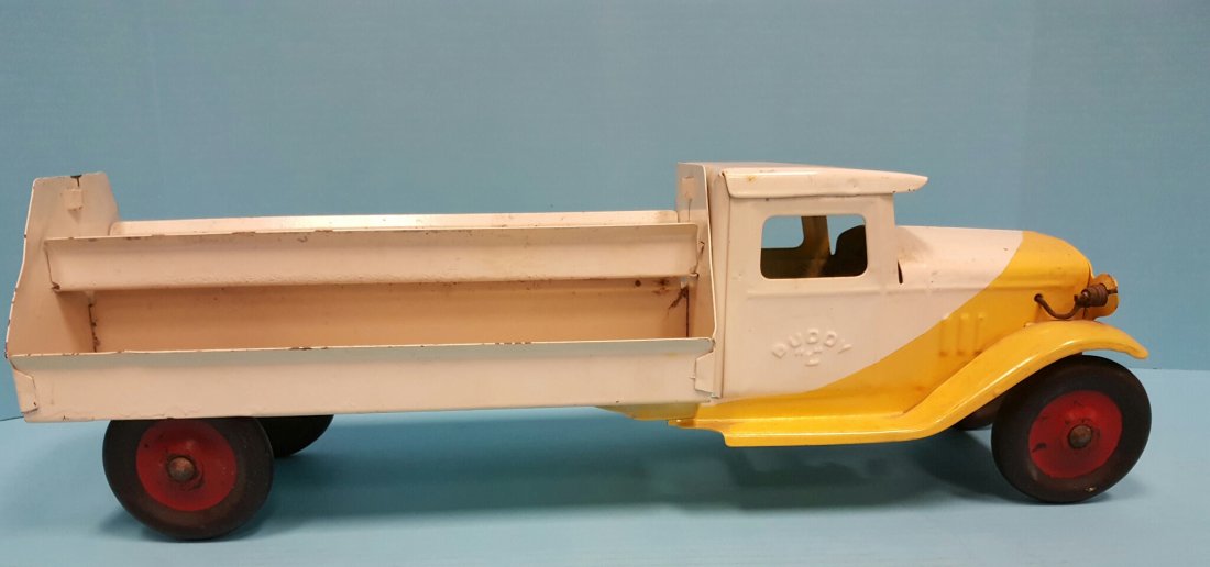 1930's Buddy L Motor Market Truck: Pressed steel truck with embossed Buddy L on both doors and hard rubber tires. The truck is missing the Motor Market sign and has been repainted. Please read and understand the shipping and payment te