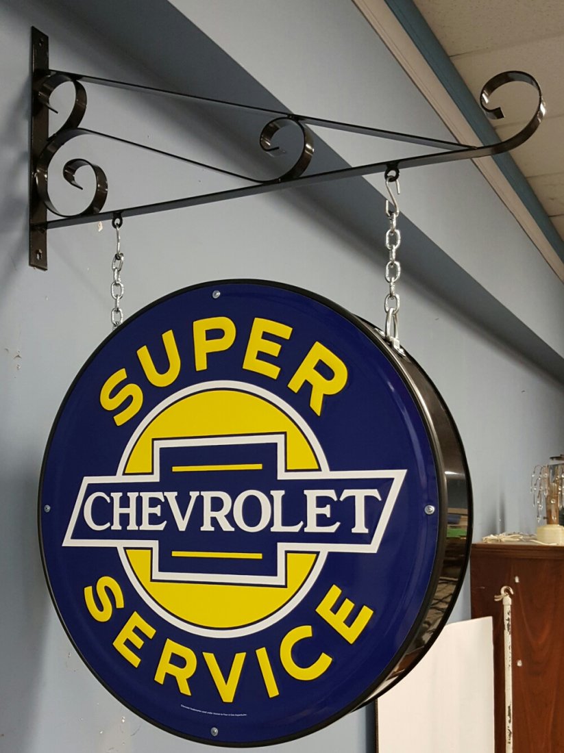 2 sided Chevrolet Super Service Sign w Hanging Bracket: 24" round 2 sided hanging sign with bracket and chains. The embossed signs are metal. New Condition. Please read & understand the payment & shipping terms list for this auction before bidding.