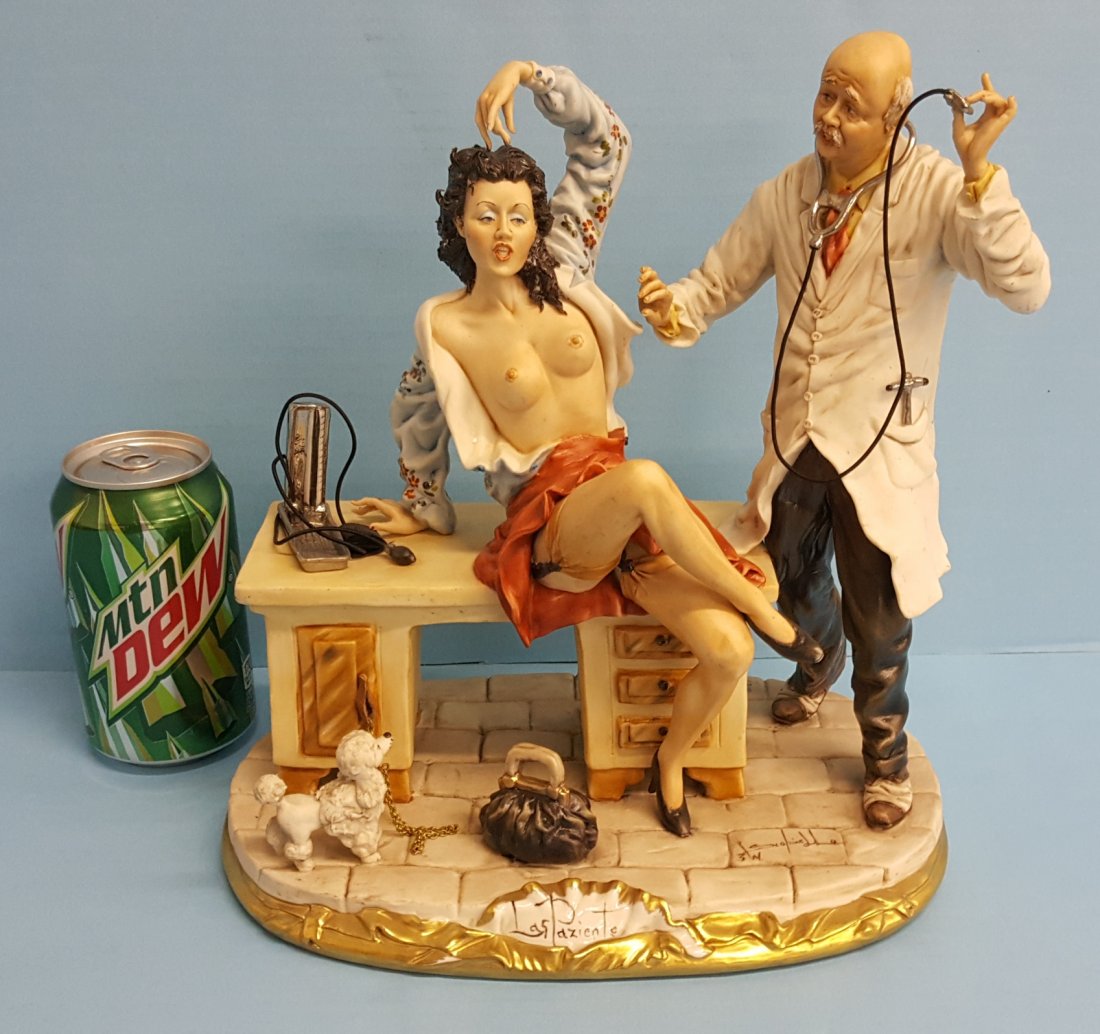 Capodimonte Doctor and Patient Porcelain Statue: 11" Risque / Nude porcelain statue of doctor examining a woman with open shirt. Signed and stamped. Please read and understand the payment and shipping terms for this auction prior to placing bids.