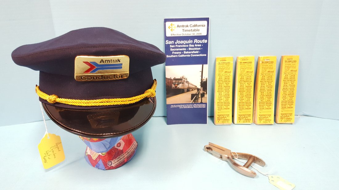 AMTRAK Conductors Cap, Punch, Timetable & PRR Tickets: Original AMTRAK cap, ticket punch, & Timetable plus 4 books of Pennsylvania Railroad Ticket books. Please read and understand the payment and shipping terms for this auction prior to placing bids.