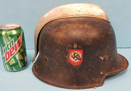 German Nazi Fire Police Helmet: WW2 Nazi Helmet with aluminum comb. The helmet has the Nazi party badge one side and the Police Eagle/Swastika wreath badge on the other side. PLEASE READ AND UNDERSTAND THE PAYMENT & SHIPPING TERMS