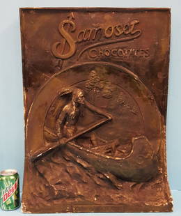 Samoset Chocolates 3D Plaster Store Display Sign: 19" x 25.5" Original painted plaster Country store display with 3d Indian in canoe. The display sign shows scuffs and a crack that runs just above the Indians head. PLEASE READ AND UNDERSTAND THE