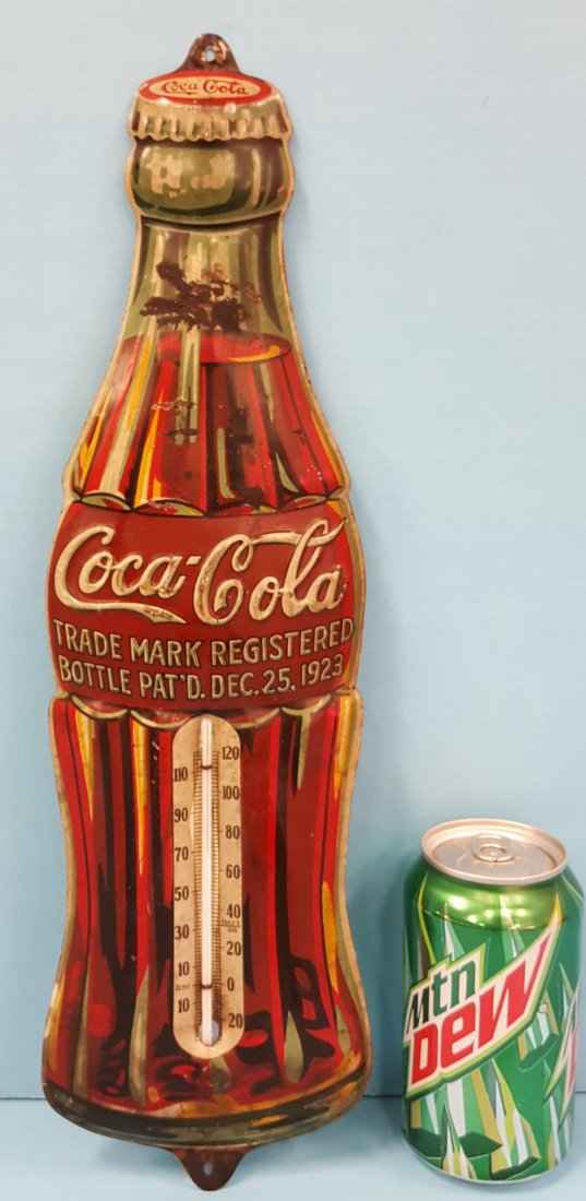 1931 Coca Cola Embossed Die Cut Bottle Thermometer: 17" x 5" Scarce embossed thermometer of the 1923 Christmas bottle. Dated 1931. Shows scuffs, scratches, stains, residue, and minor rust. PLEASE READ THE PAYMENT & SHIPPING TERMS FOR THIS AUCTION PRIOR