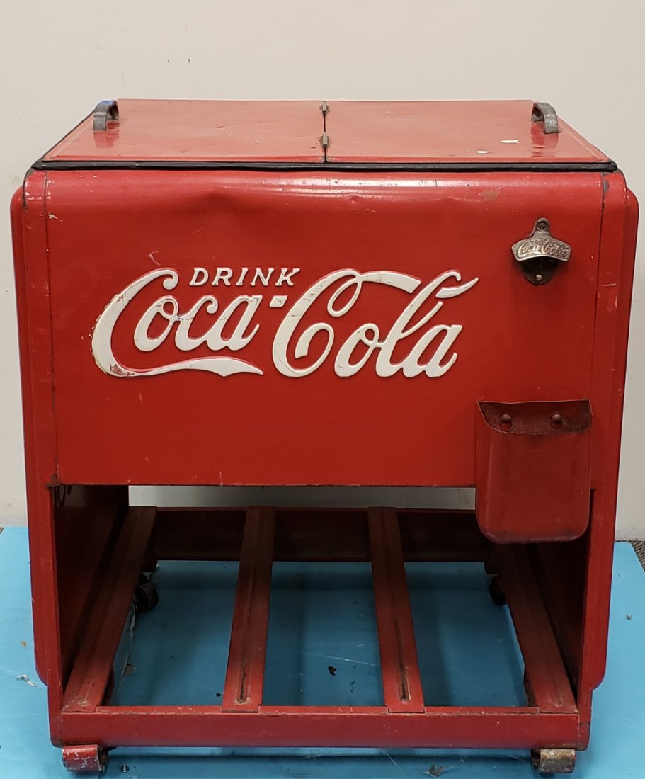 Coca Cola Cooler: 31" x 26" x 35"h Original embossed 2 door cooler with original embossed Coca Cola opener and cap catcher. The cooler shows scuffs, scratches, and dings. PLEASE READ THE PAYMENT & SHIPPING TERMS FOR TH