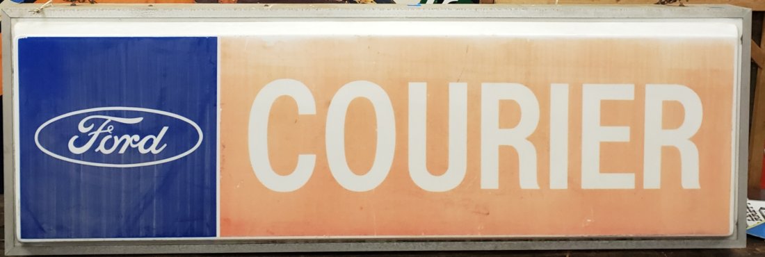 RARE Ford Courier Light Up Sign: 73" x 24" Plastic light up sign in an aluminum can. Chord is cut. Scuffs, scratches, and a few small holes. PLEASE READ & UNDERSTAND THE PAYMENT & SHIPPING TERMS FOR THIS AUCTION PRIOR TO PLACING BIDS