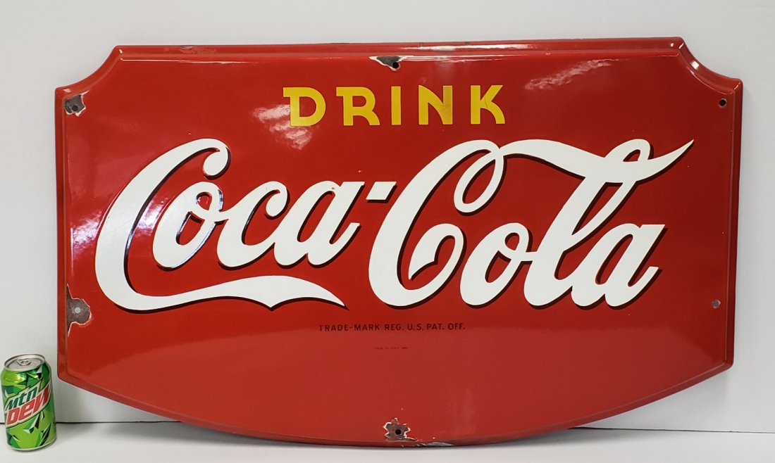 1945 Porcelain Drink Coca Cola Sign: 36.5" x 22.5" Porcelain sign with bright colors, high gloss, & minor porcelain chips. PLEASE READ AND UNDERSTAND THE PAYMENT & SHIPPING TERMS FOR THIS AUCTION PRIOR TO PLACING BIDS