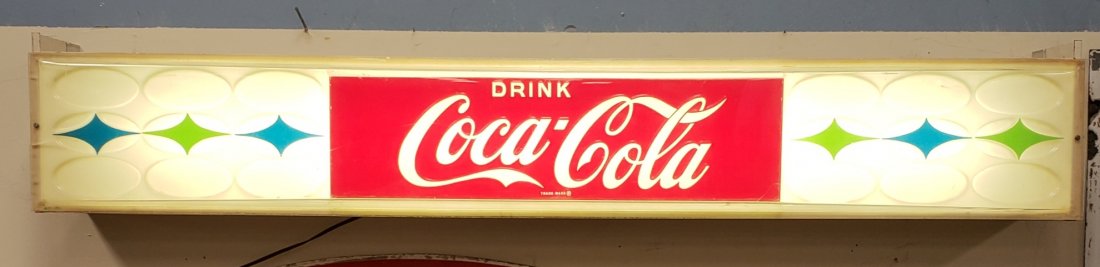 Coca Cola light up sign: 51"w x 8"h x 6"d Embossed plastic light up sign win excellent condition with minor scuffs. PLEASE READ & UNDERSTAND THE PAYMENT & SHIPPING TERMS FOR THIS AUCTION PRIOR TO PLACING BIDS.
