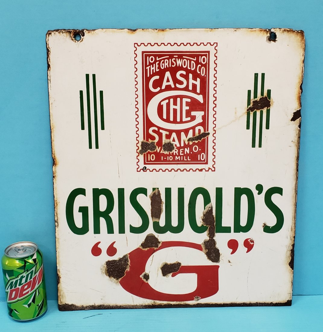 Porcelain Griswold's Sign: 16" x 18.5" double sided porcelain sign with bright colors, porcelain chips, and stains. PLEASE READ & UNDERSTAND THE PAYMENT & SHIPPING TERMS FOR THIS AUCTION PRIOR TO PLACING BIDS.