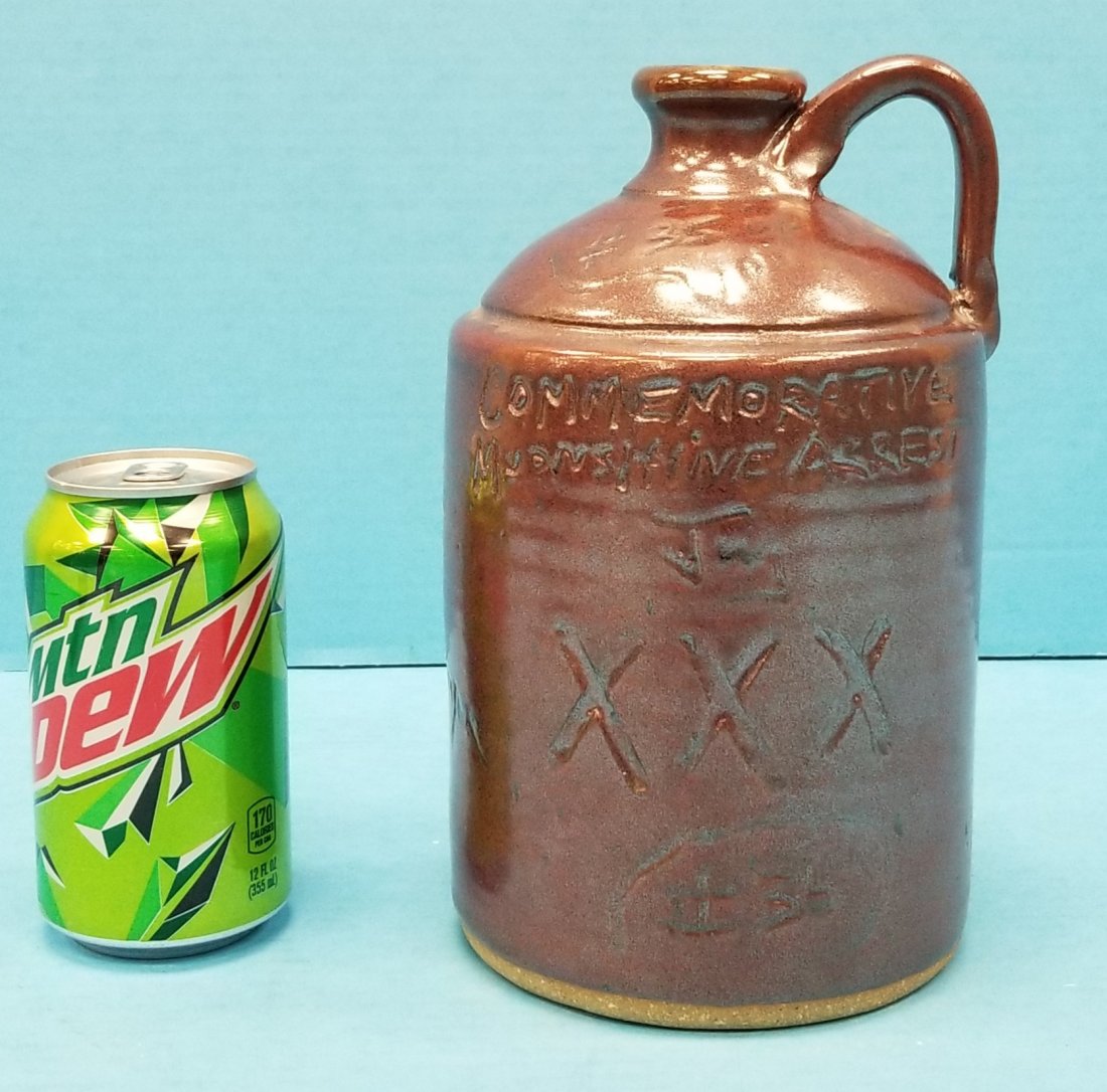 Clete Meaders Commemorative Moonshine Jug: 9" Jug #35 Signed & dated 2011 on bottom with poem on the back. PLEASE READ & UNDERSTAND THE PAYMENT & SHIPPING TERMS FOR THIS AUCTION PRIOR TO PLACING BIDS.