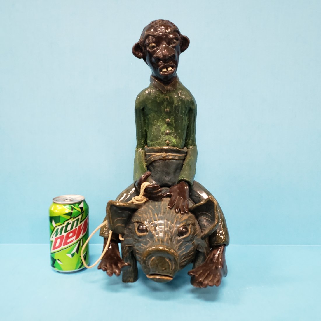 Lin Craven Black Man Riding Pig Southern Folk Pottery: 16" 1999 detailed pottery pig with black man riding. Excellent condition. Signed and dated on the bottom. PLEASE READ & UNDERSTAND THE PAYMENT & SHIPPING TERMS FOR THIS AUCTION PRIOR TO PLACING BIDS.