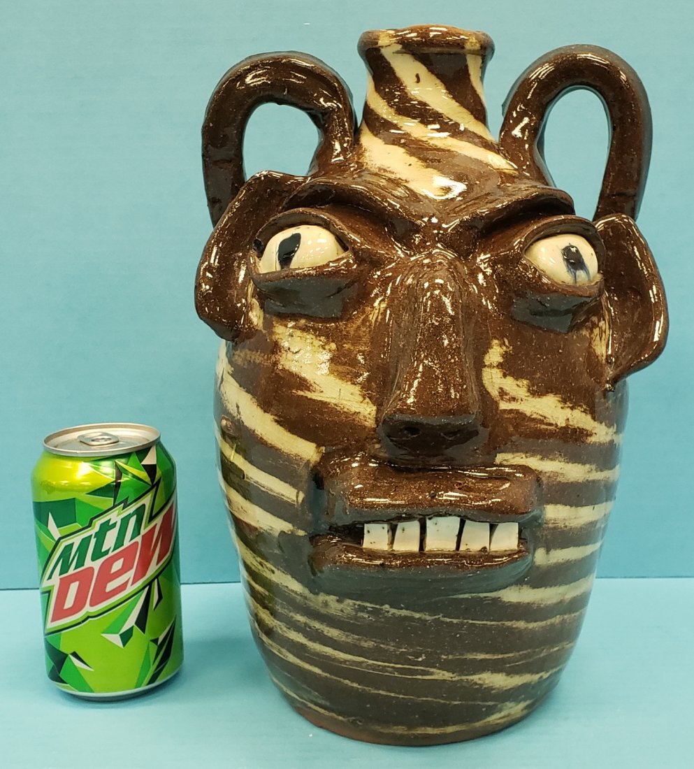 Burlon Craig Face Jug NC Folk Art Pottery: 12" Glazed face jug with two color swirl clay. In excellent condition with crazing. PLEASE READ & UNDERSTAND THE PAYMENT & SHIPPING TERMS FOR THIS AUCTION PRIOR TO PLACING BIDS.