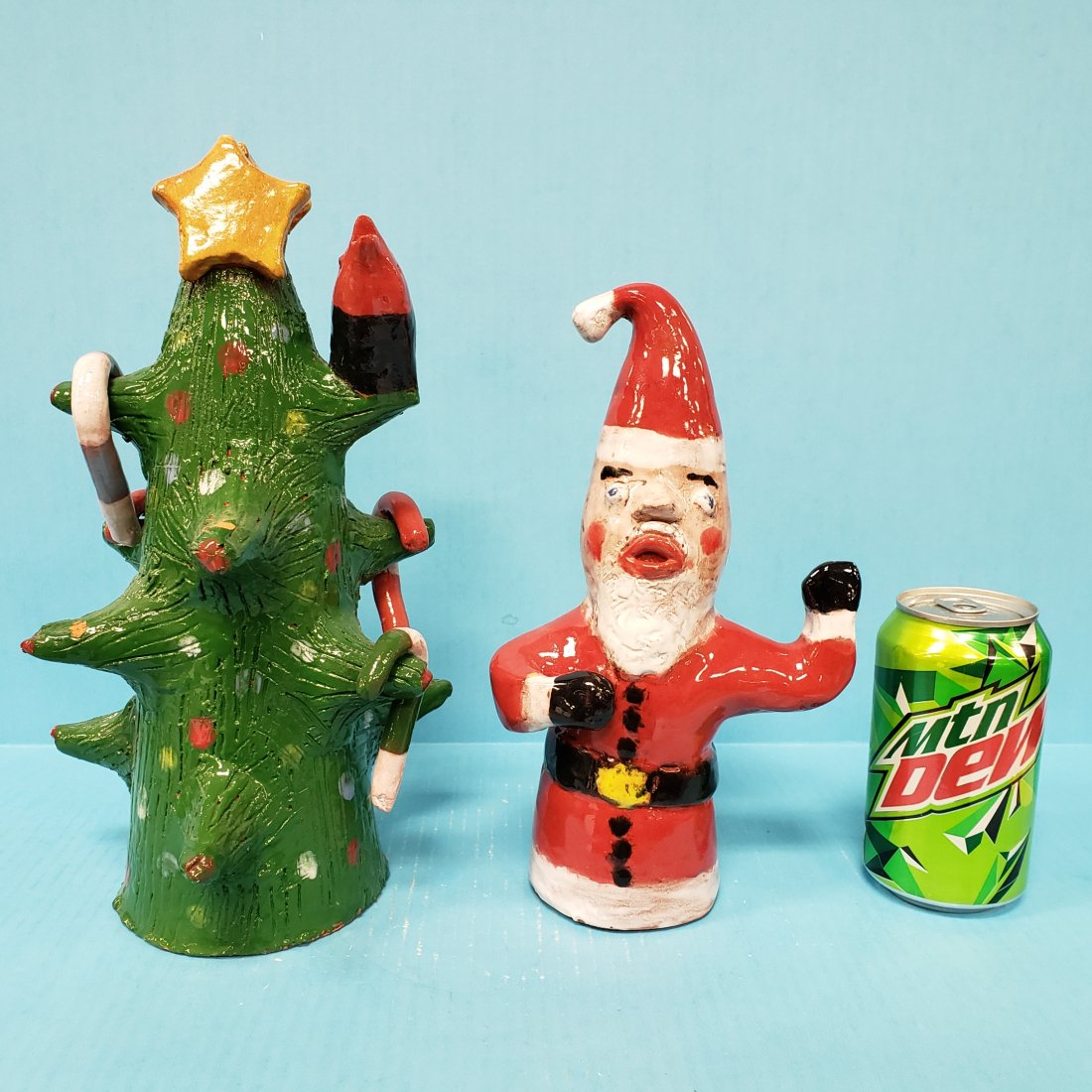 Larry Wilson Christmas Tree & Santa Folk Art Pottery: 11.75" Christmas tree with candy canes, star, and bird signed LW on the bottom. 10" Santa signed LW on the back. Excellent condition. PLEASE READ & UNDERSTAND THE PAYMENT & SHIPPING TERMS FOR THIS AUC