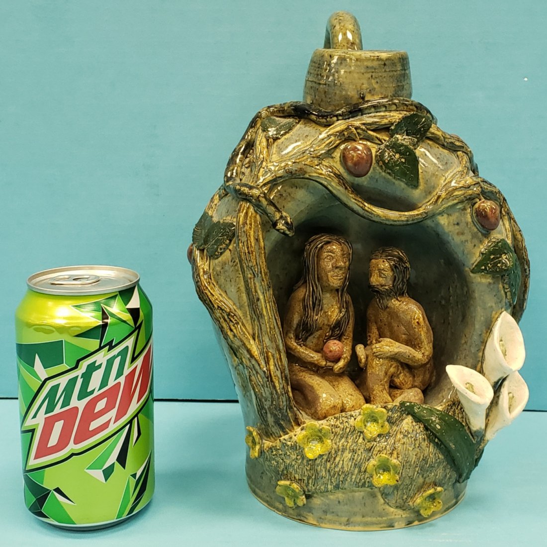 Lin Craven Adam & Eve Prototype 1 Jug: 10" Detailed glazed Adam and Eve Prototype 1 jug with serpent and the apple tree. Signed and dated Lin Craven Prototype 1 2009. PLEASE READ & UNDERSTAND THE PAYMENT & SHIPPING TERMS FOR THIS AUCTION P