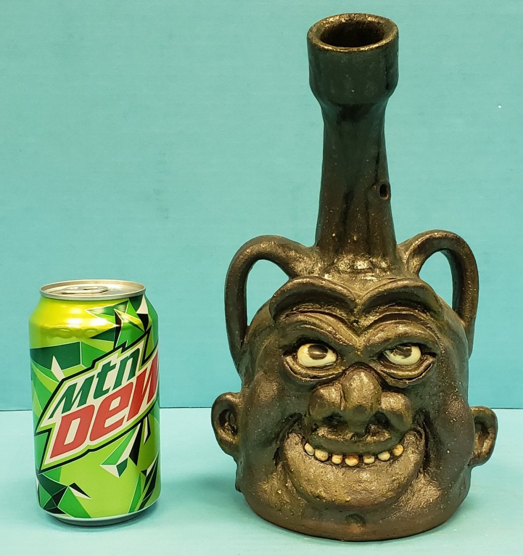 Clete Meaders Willie Nelson Face Jug: 10" Severn tooth face jug with Willie Nelson jug on the back, signed and dated 2010 on the bottom. Excellent condition. PLEASE READ & UNDERSTAND THE PAYMENT & SHIPPING TERMS FOR THIS AUCTION PRIOR TO 