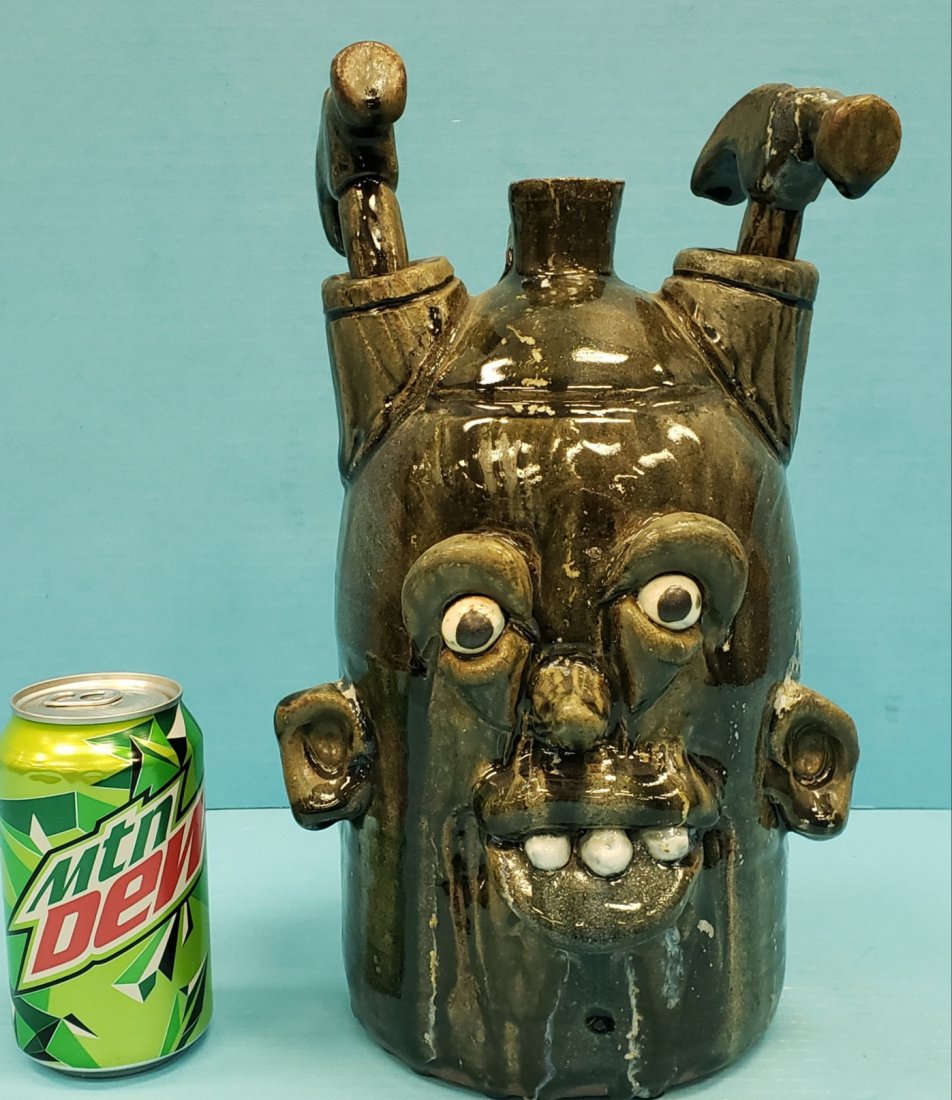 Clete Meaders Hammerhead Face Jug: 12"h Glazed jug with verse on the back. Excellent condition. Signed and dated 2009 on the bottom. PLEASE READ & UNDERSTAND THE PAYMENT & SHIPPING TERMS FOR THIS AUCTION PRIOR TO PLACING BIDS.