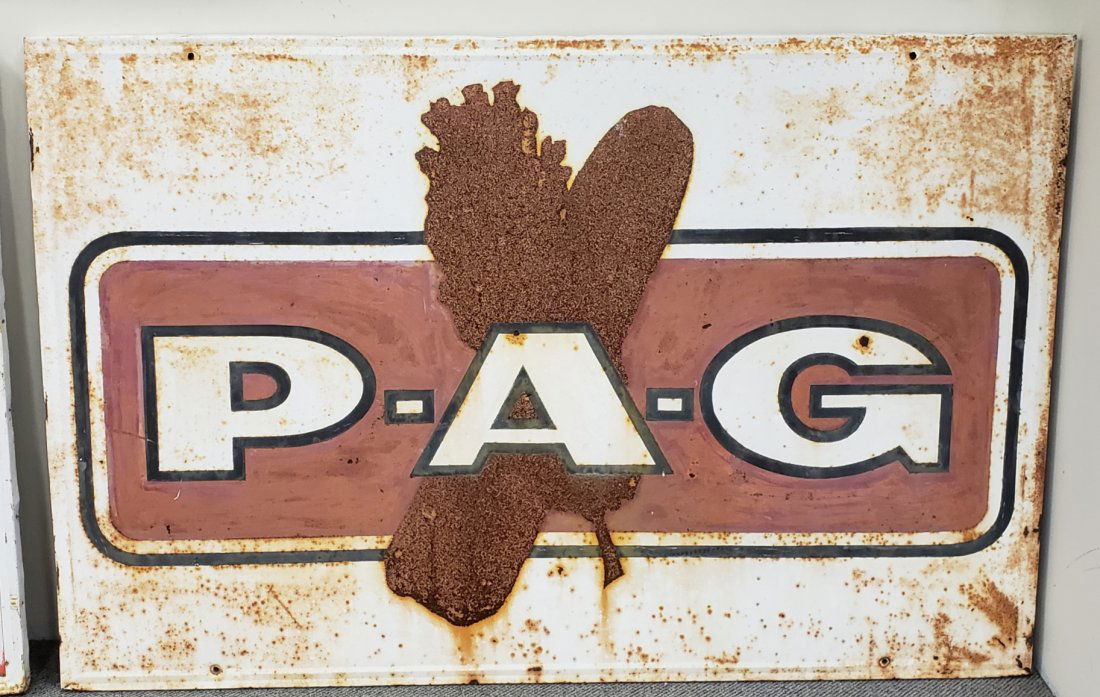 P-A-G Metal Farm Sign: 70" x 46" Tin sign over wood frame. Faded and rust throughout field. PLEASE READ & UNDERSTAND THE PAYMENT & SHIPPING TERMS FOR THIS AUCTION PRIOR TO PLACING BIDS.