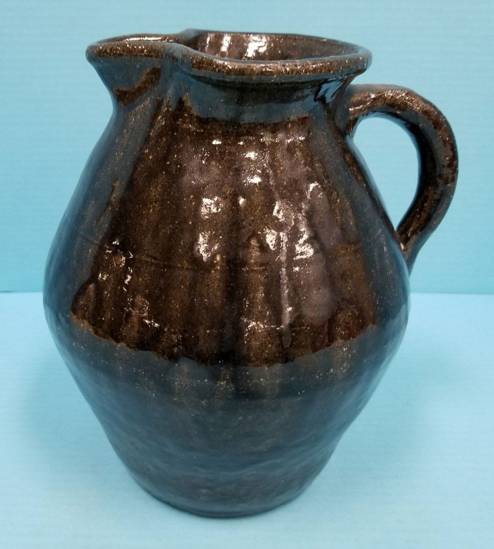 Lanier Meaders Pitcher: Glazed pitcher signed Lanier Meaders on bottom in excellent condition. Battery operated. PLEASE READ AND UNDERSTAND THE PAYMENT AND SHIPPING TERMS FOR THIS AUCTION PRIOR TO PLACING BIDS. ALL BIDDERS A