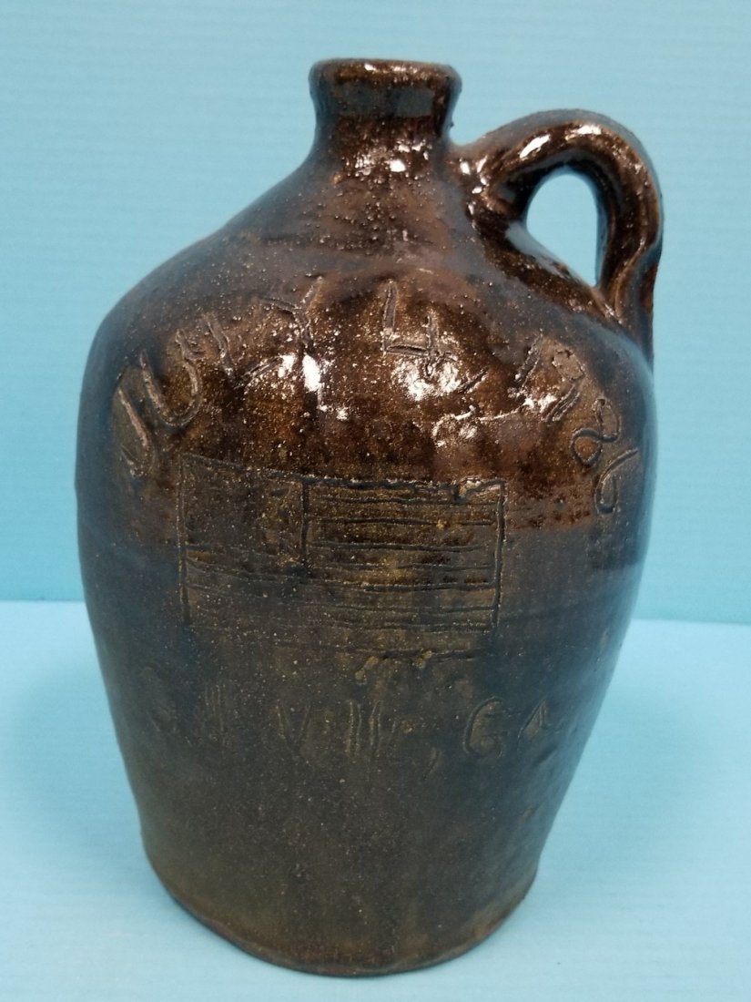 Chester Hewell July 4th 1986 Jug: 10.5" glazed jug with flag and July 4th 1986 Gillsville Ga. on one side and stars and stripes on the other. PLEASE READ AND UNDERSTAND THE PAYMENT AND SHIPPING TERMS FOR THIS AUCTION PRIOR TO PLACING 