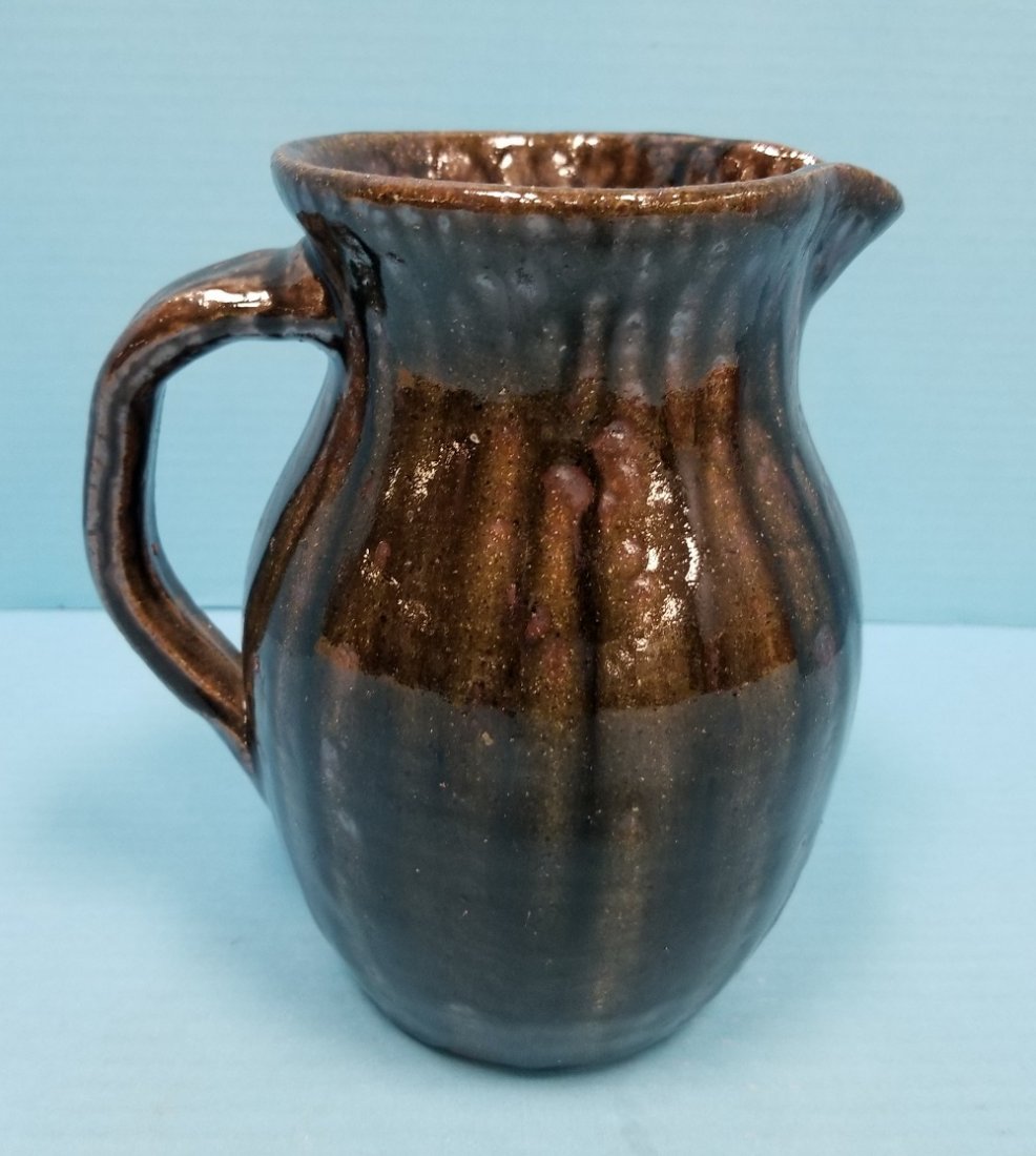Cleater & Billie Meaders Pitcher Folk Pottery: 7.5" glazed pitcher signed and dated Aug. 18th 2001 on the bottom. Excellent condition. PLEASE READ & UNDERSTAND THE PAYMENT & SHIPPING TERMS FOR THIS AUCTION PRIOR TO PLACING BIDS. ALL BIDDERS ARE BO