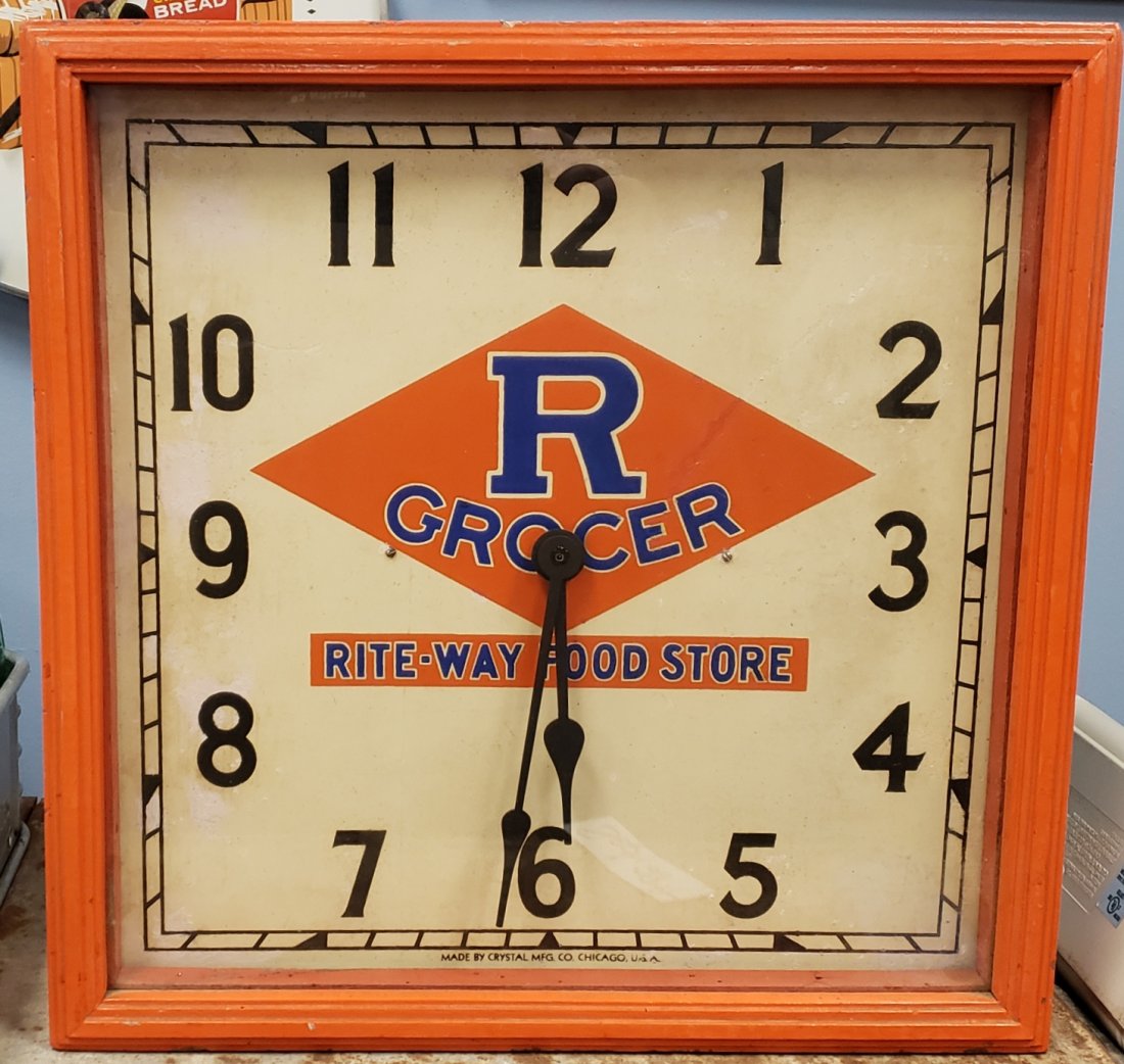R Grocer Rite-Way Food Store Clock: 15.5" x 15.5" Original wood clock with glass face. The mechanism has been replaced with a battery operated mechanism. Some fading scuffs and touch ups on the clock face. PLEASE READ AND UNDERSTAND THE