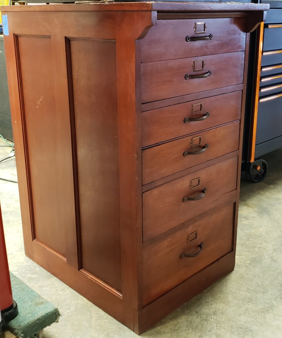 6 Drawer Wood Cabinet: 22"w x 41"h 31"d wood cabinet with metal handles. The cabinet will hold a cash register or a slot machine. The jukebox in the photo is for effect only and is not part of this lot. YOU ARE BIDDING ON T