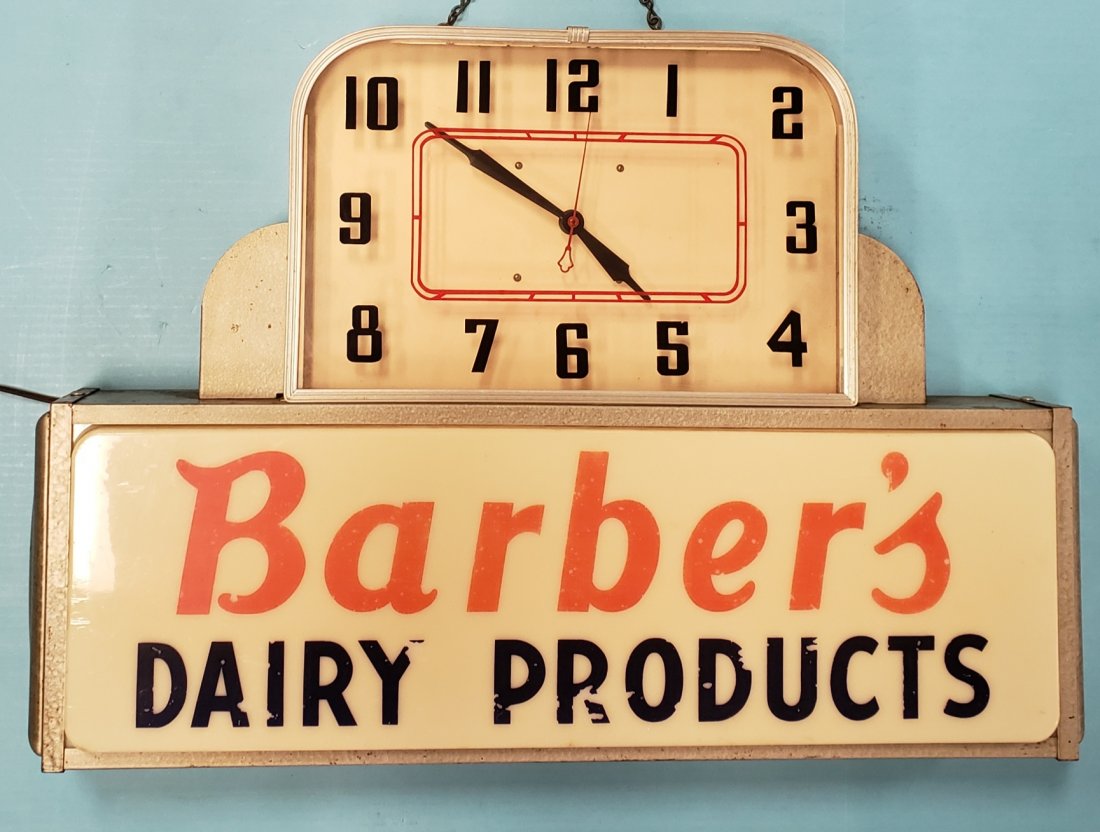 Barber's Dairy Light Up Clock: 25"w x 18"h x 4.5"d Original deco style working clock with light up advertising on bottom. Normal wear including scuffs. PLEASE READ & UNDERSTAND THE PAYMENT & SHIPPING TERMS FOR THIS AUCTION PRIOR TO