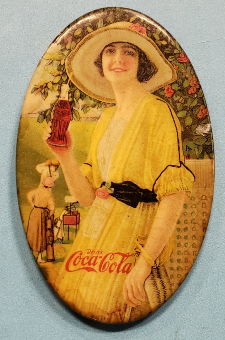 1920 Coca-Cola Pocket Mirror: 2.75" Pocket mirror featuring girl with golf club. Bright colors with a couple minor stains. The mirror has a crack across the middle. PLEASE READ & UNDERSTAND THE PAYMENT & SHIPPING TERMS FOR THIS AU