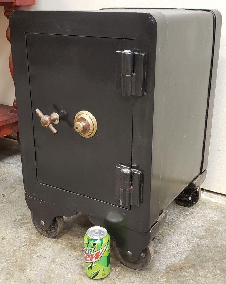 Cast Iron Safe: 16"w x 17"d x 25.5" Cast iron safe on wheels with combination. PLEASE READ & UNDERSTAND THE PAYMENT & SHIPPING TERMS FOR THIS AUCTION PRIOR TO PLACING BIDS.